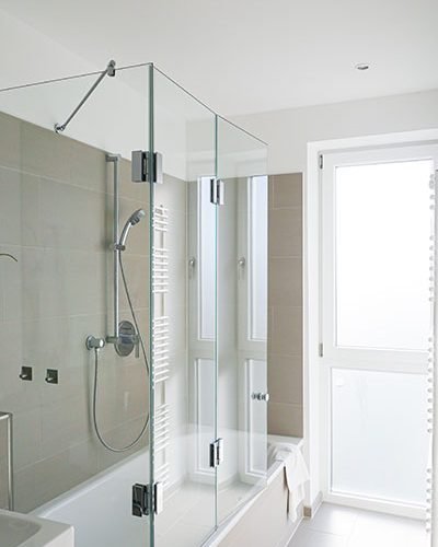 vertical-shot-of-a-modern-white-bathroom-with-show-2023-11-27-05-08-45-utc